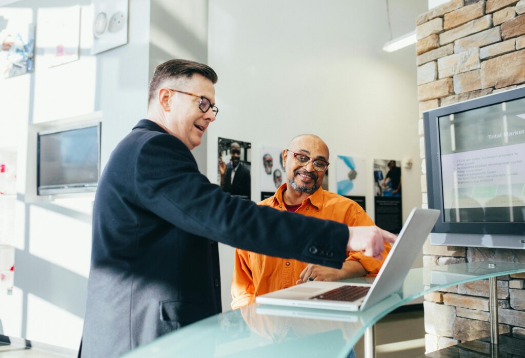 Man pointing at his computer.